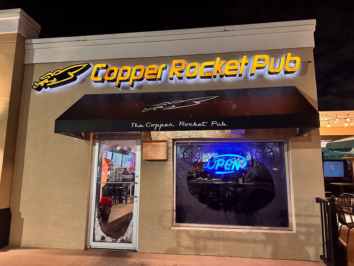 copper rocket pub building with yellow sign